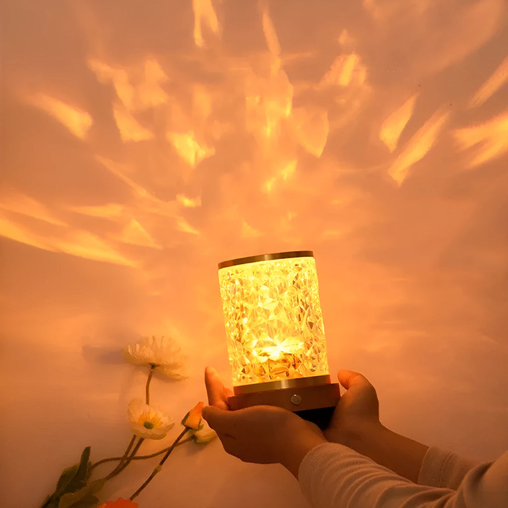 Acrylic and solid wood LED crystal night light with rotating colourful water ripple projection on dark background
