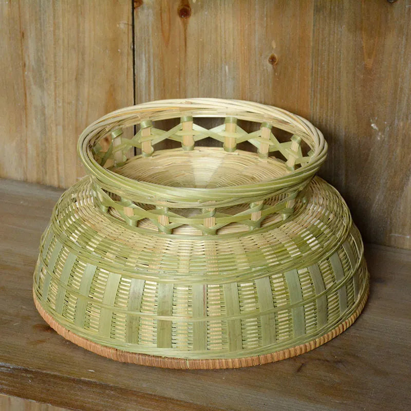 Three handmade bamboo storage baskets in different sizes including one with deepening design