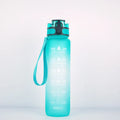 Transparent 1000ml BPA-free Tritan sports bottle with infuser and clear liquid visible