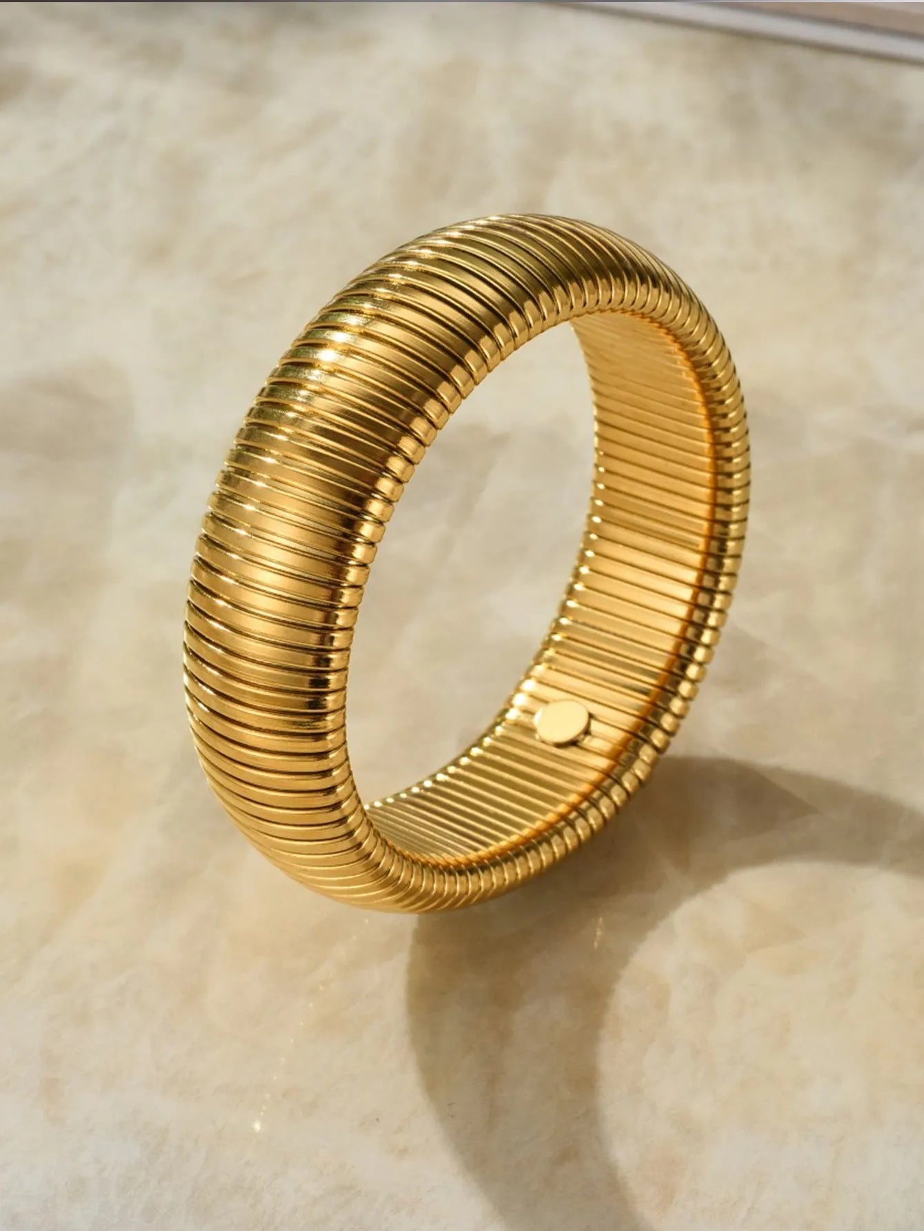 Women's titanium steel bracelet with vertical stripe pattern in gold or silver finish