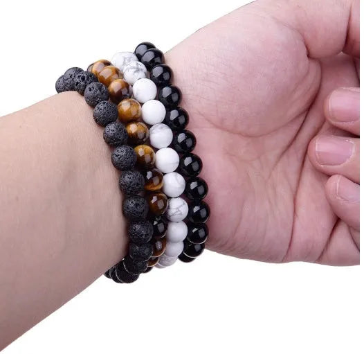 Black agate geometric bracelet with 8mm beads on a black elastic cord for women.