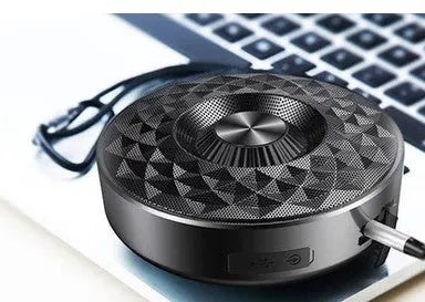 Compact cylindrical Bluetooth speaker in black, orange or silvery white colour with wireless connectivity