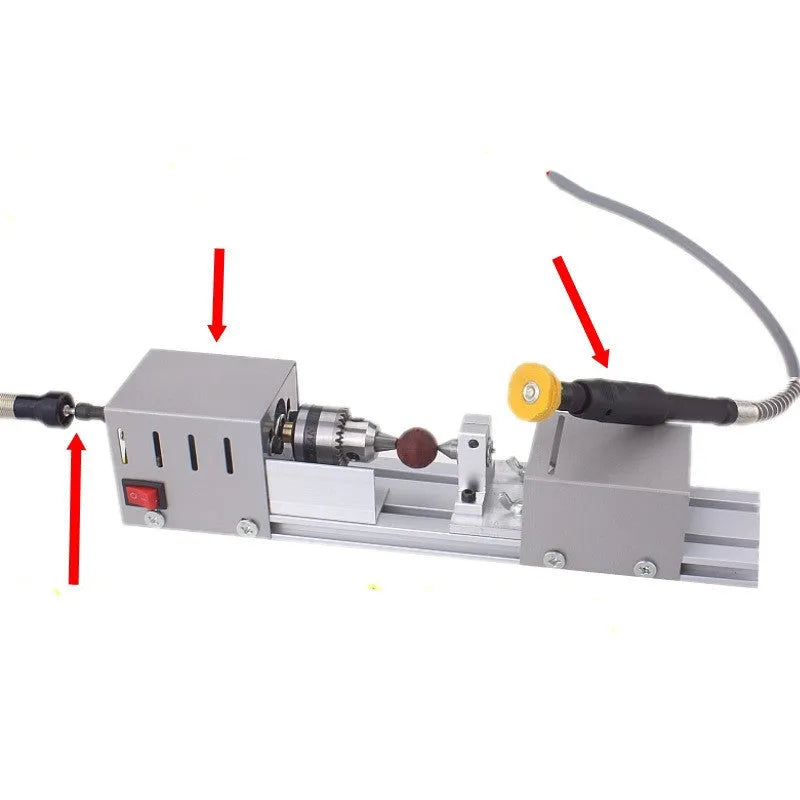 Compact metal mini woodworking lathe with carving knives on workbench