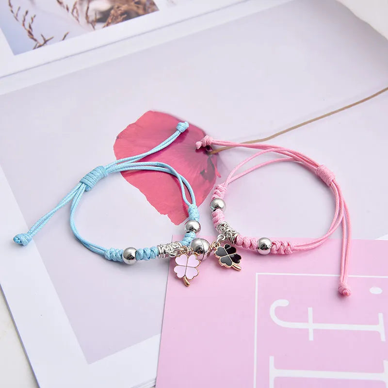 Magnetic clasp couple bracelets with alloy construction and symbolic designs including crown and love lock motifs.