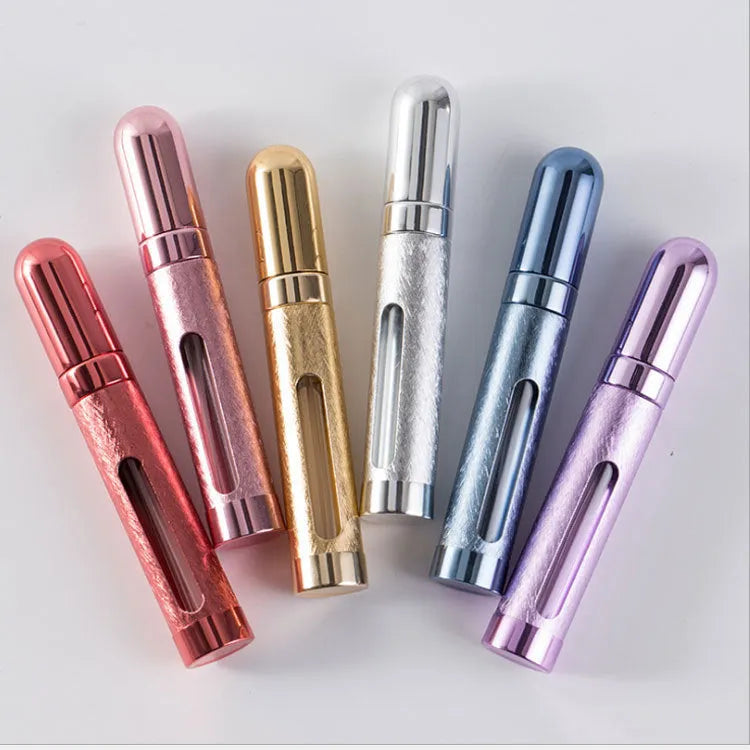 A slim, portable 12ml aluminium perfume bottle with a glass liner in choice of colours including blue, golden, pink, red, silvery, and violet.