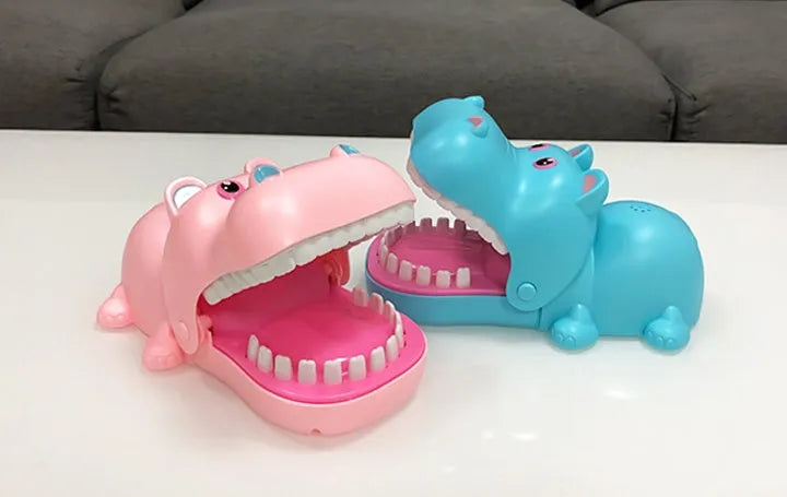 Multicoloured plastic bite hand animal interactive toy showing dog, crocodile, shark, and hippo designs