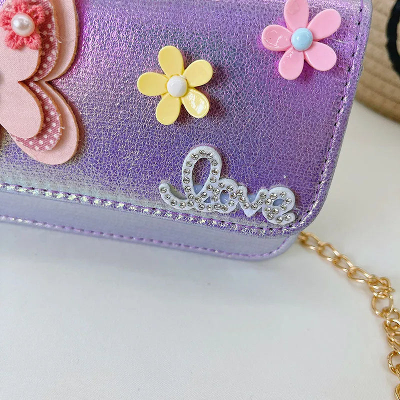 Children's small PU leather shoulder bag with letter print in rose red, showing zipper closure and multiple internal slots