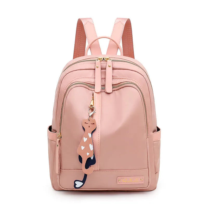 Women's casual backpack in black or pink with 20L capacity, waterproof nylon construction, and internal organiser compartments