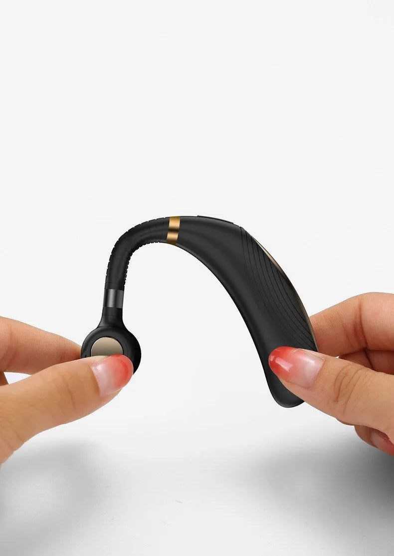 Wireless hanging ear business Bluetooth headset in black with charging port visible