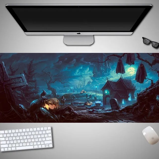 Oversized Halloween graphic cloth mouse pad on a desk, showing non-slip rubber base.