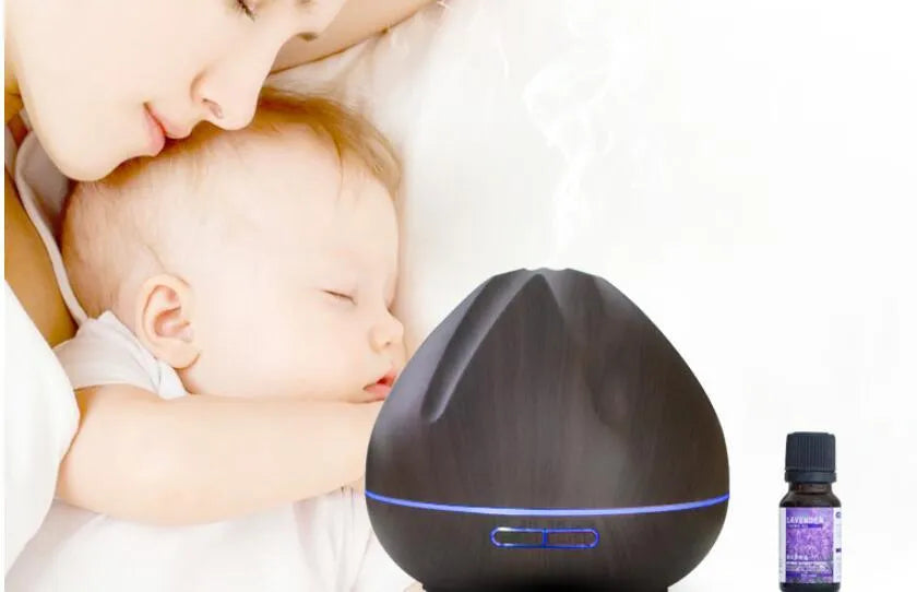Air humidifier aromatherapy machine with 500ml capacity in dark wood finish on a table