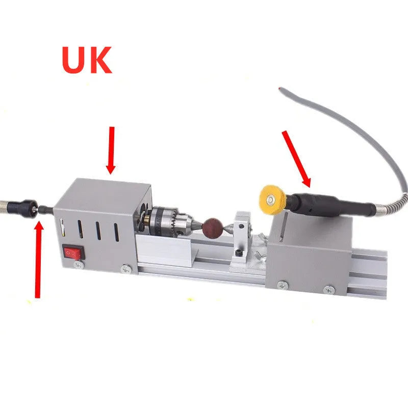 Compact metal mini woodworking lathe with carving knives on workbench