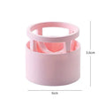 Pink plastic beauty egg stand cosmetics storage rack in girly heart style on a bedroom desktop