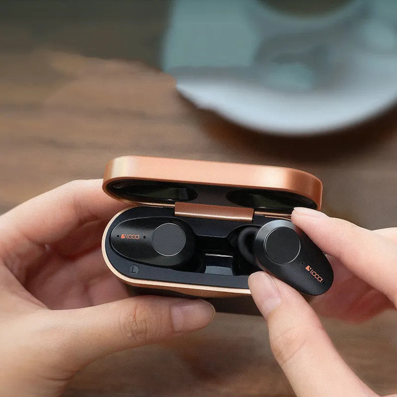 Black wireless Bluetooth headset with charging stand featuring ANC noise cancellation.