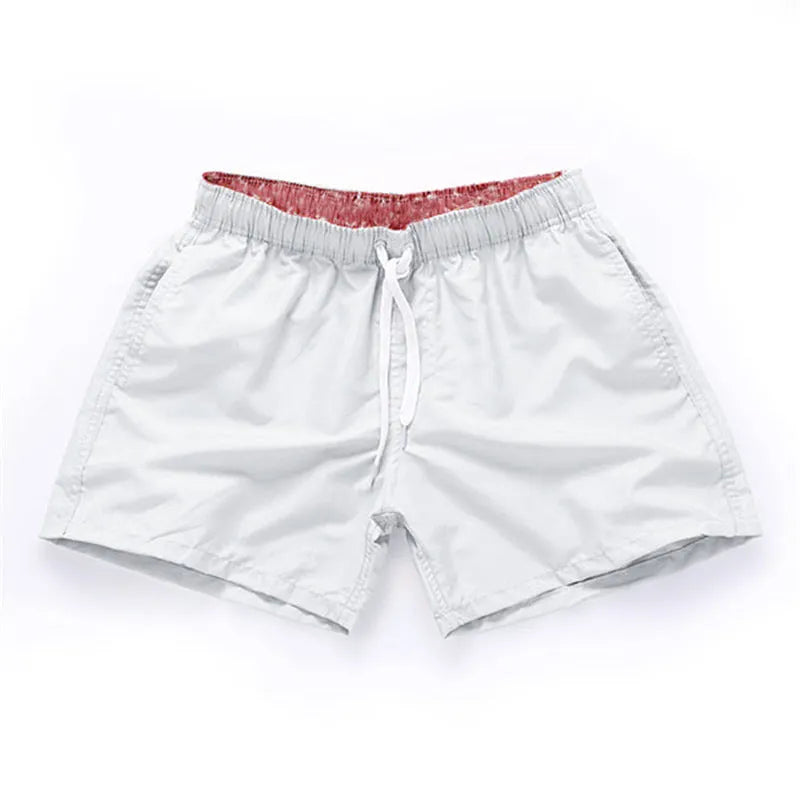 Men's straight leg polyester board shorts on a hanger, available in multiple colours and plus sizes.