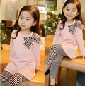 Pink cotton jersey knit clothing set for a girl, showing short-sleeved top and elasticated waist trousers.