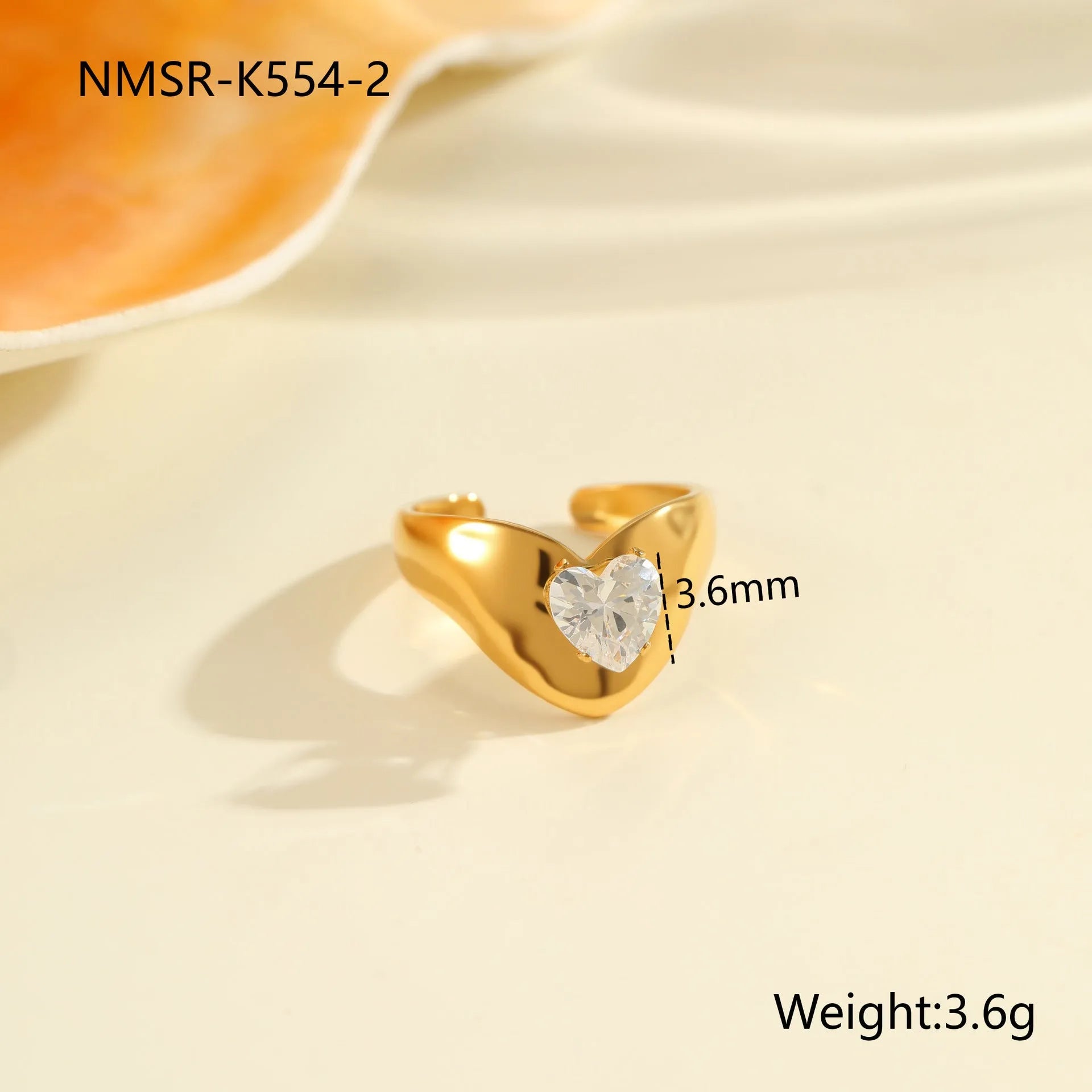Adjustable geometric stainless steel ring showing open mouth design and colour variations