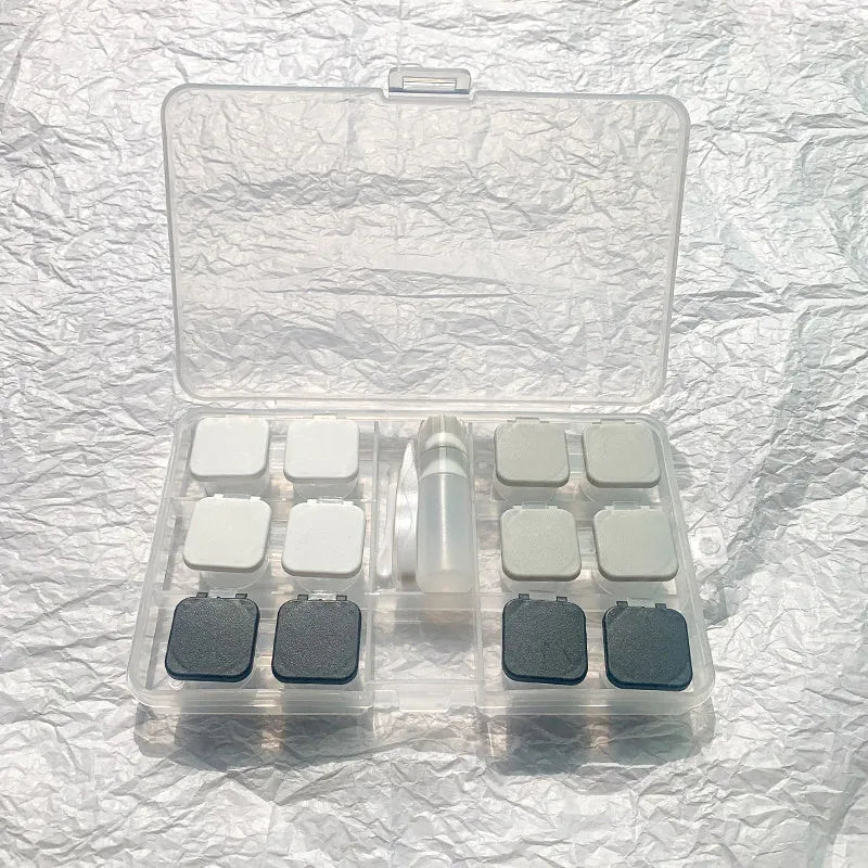 Portable rectangular contact lens case in various colours with a compact design.