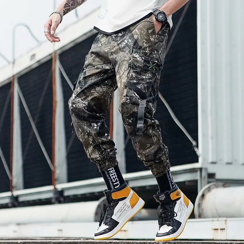 Hip hop jogger pants in khaki cotton fabric with elastic cuffs, shown flat
