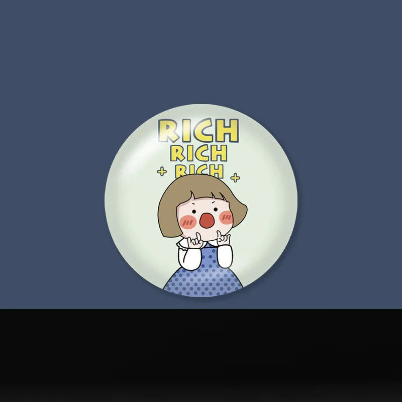 Creative telescopic glue cartoon phone airbag bracket in colour C1 girl design on a desk holding a smartphone