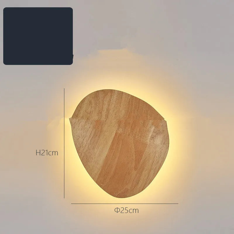 Log Art wood LED wall lamp with oval shape and warm light on a white wall