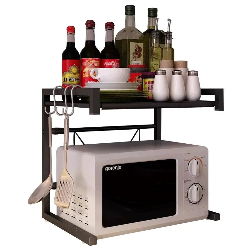 Retractable metal kitchen microwave rack with two layers on a countertop