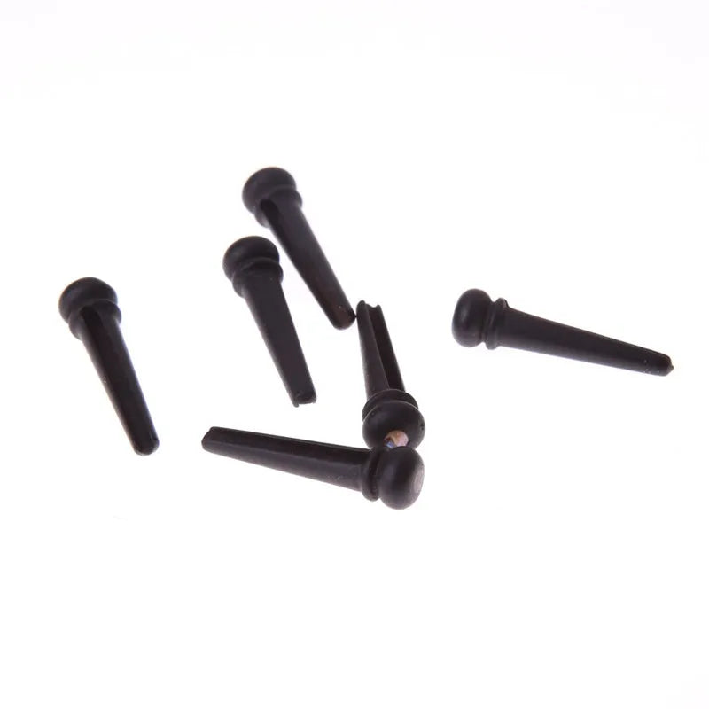 Six matte black ebony guitar bridge pins with a 5.3mm bayonet for folk acoustics.