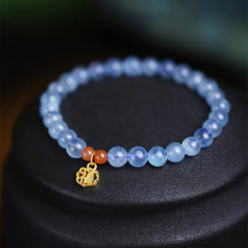 Icy translucent natural aquamarine crystal bracelet with 8mm round beads and a blessing card.