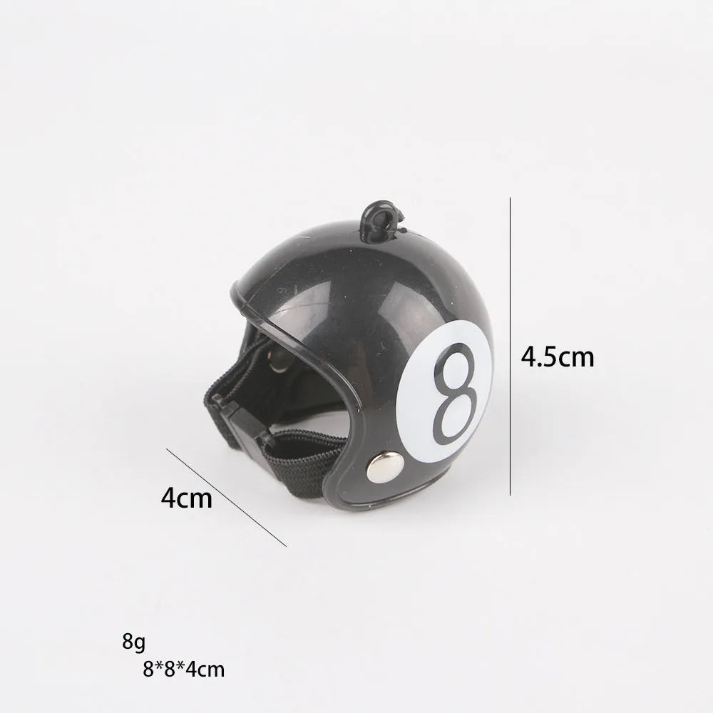 Small adjustable plastic safety helmet for a chicken or bird, shown in a fun design.