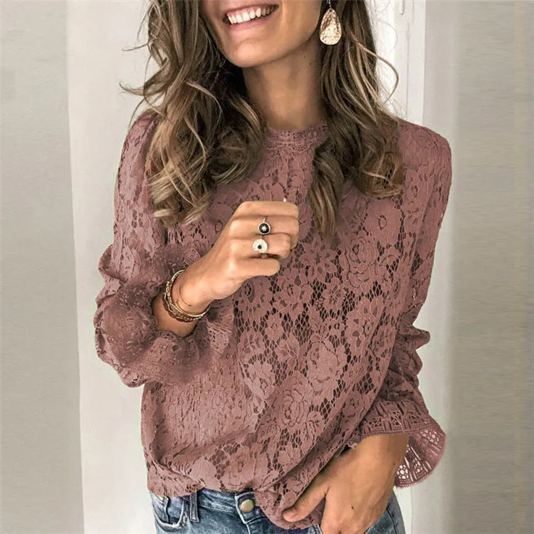 Women's green loose-fit lace shirt with hollow-out detailing and a zip, long sleeves, and a round neck.