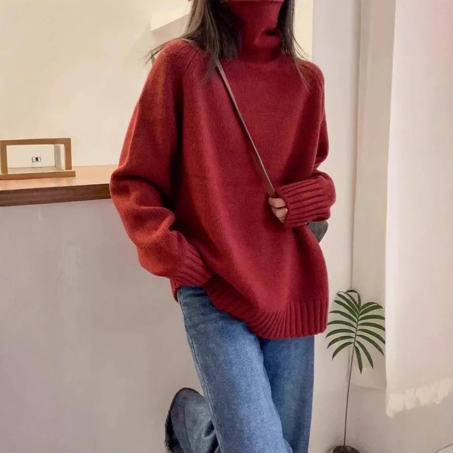 Women's loose grey turtleneck sweater with a thick, textured curling pile collar