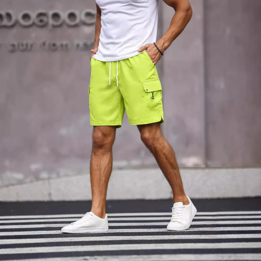 Men's loose fit workwear shorts in fluorescent green or army green with straight leg and fifth-pants length.