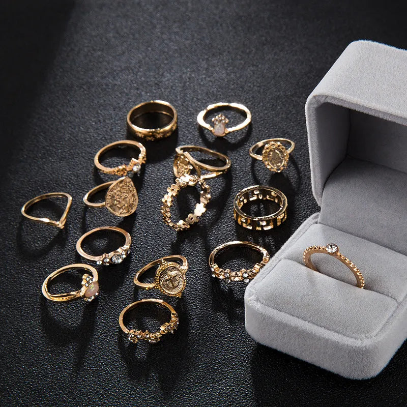 12-piece cross ring set in gold alloy on a flat surface, showing one size design