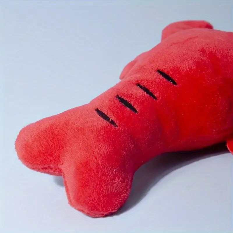 Red lobster-shaped squeaky plush dog toy with bite-resistant construction for small and medium breeds