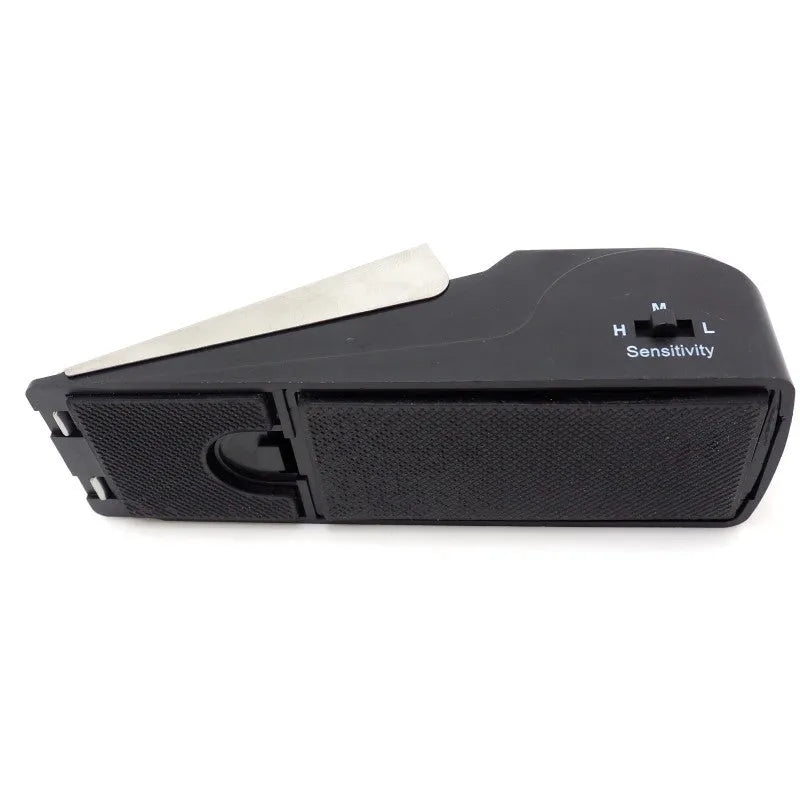 Black 120dB door stop alarm with stainless steel cover and wedge shape, measuring 14cm long