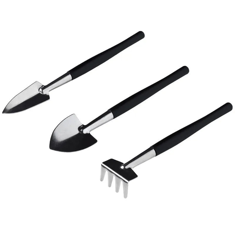 Black plastic and metal miniature garden tool set for succulents with cushion and watering bottle