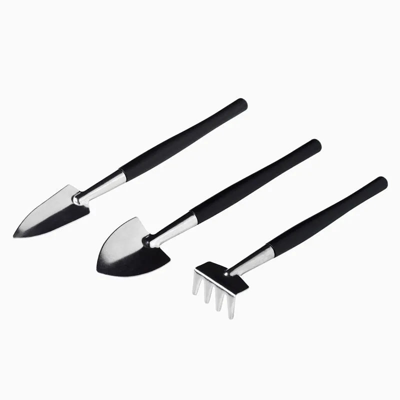 Black plastic and metal miniature garden tool set for succulents with cushion and watering bottle