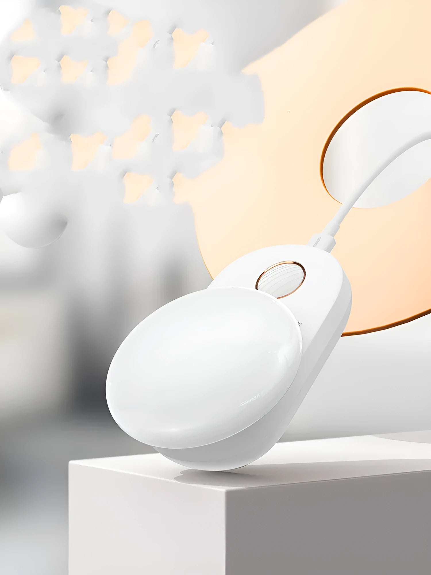 White Baseus rechargeable sensor night light with LED glow on a bedside table.