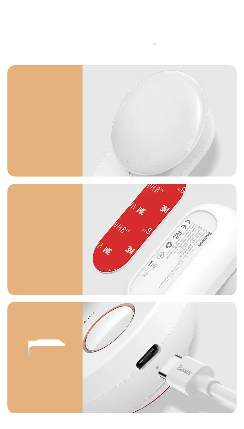 White Baseus rechargeable sensor night light with LED glow on a bedside table.