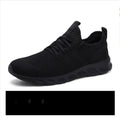 Men's black and white mesh sport shoes with lace-up front and round toe design