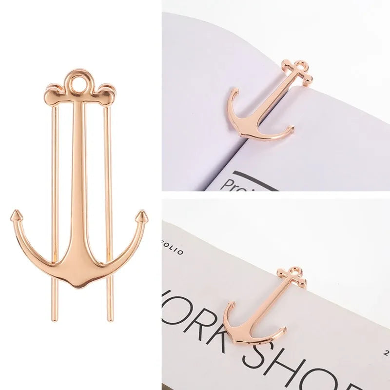 Creative metal bookmark page folder in silver colour, 1.78 x 6.6 cm, on an open book
