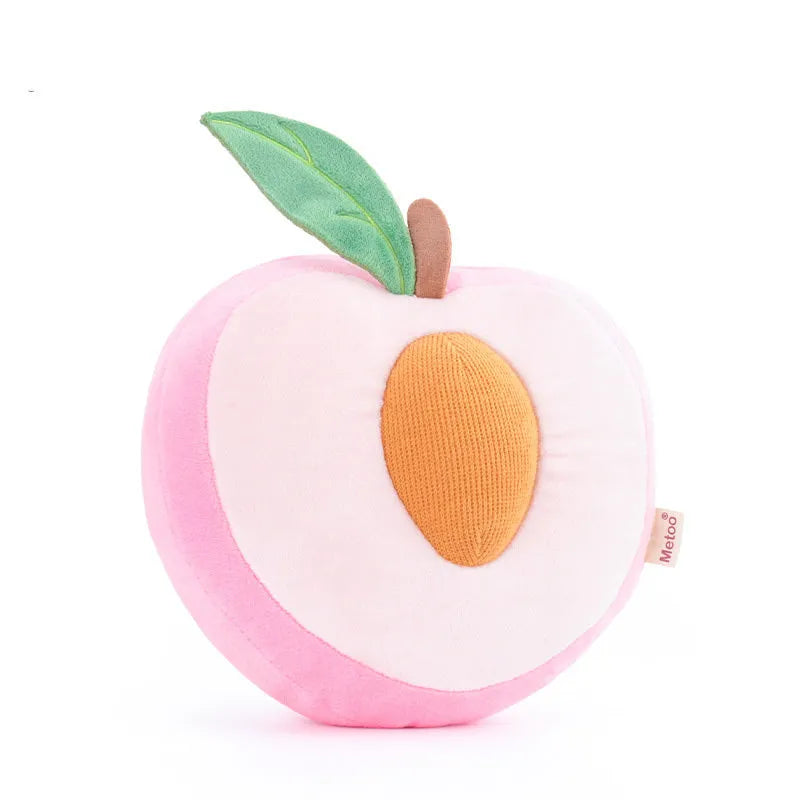 Soft plush fruit pillow toy in peach colour, with sweet expression, made of cotton