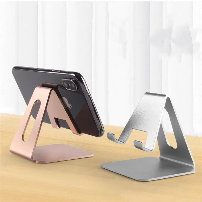 Adjustable metal desktop mobile phone holder in black with device inserted, compatible with all phone brands
