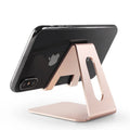 Adjustable metal desktop mobile phone holder in black with device inserted, compatible with all phone brands