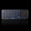 Black wireless mini keyboard with a touch screen panel, shown with USB receiver, for teaching and presentations.