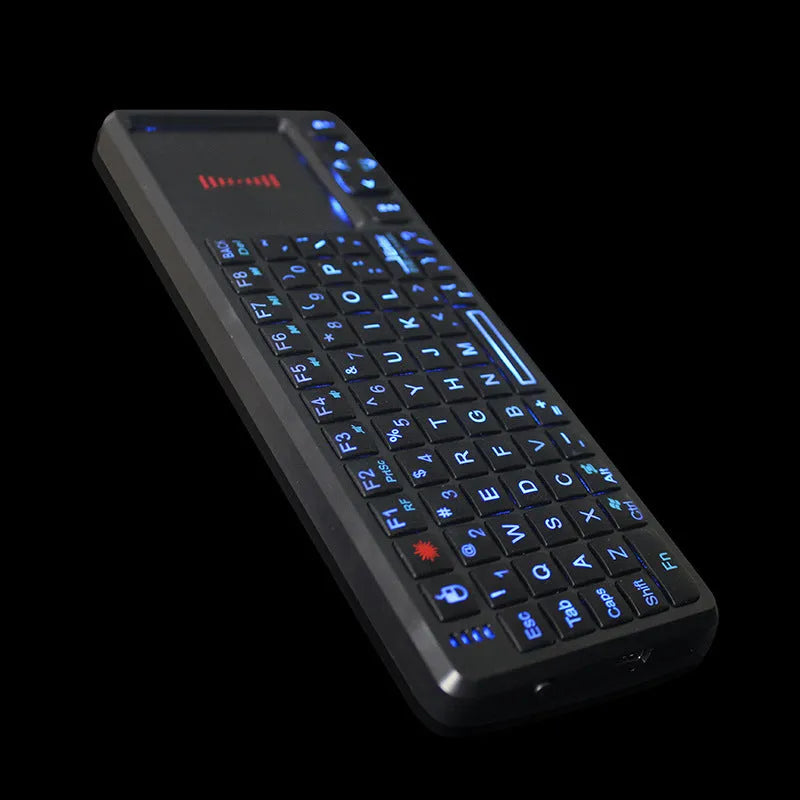 Black wireless mini keyboard with a touch screen panel, shown with USB receiver, for teaching and presentations.