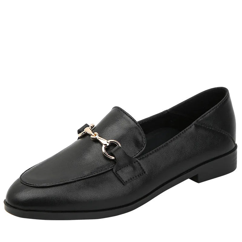 Women's black leather flat shoes with round toe, low heel 1-3cm, and rubber sole on white background
