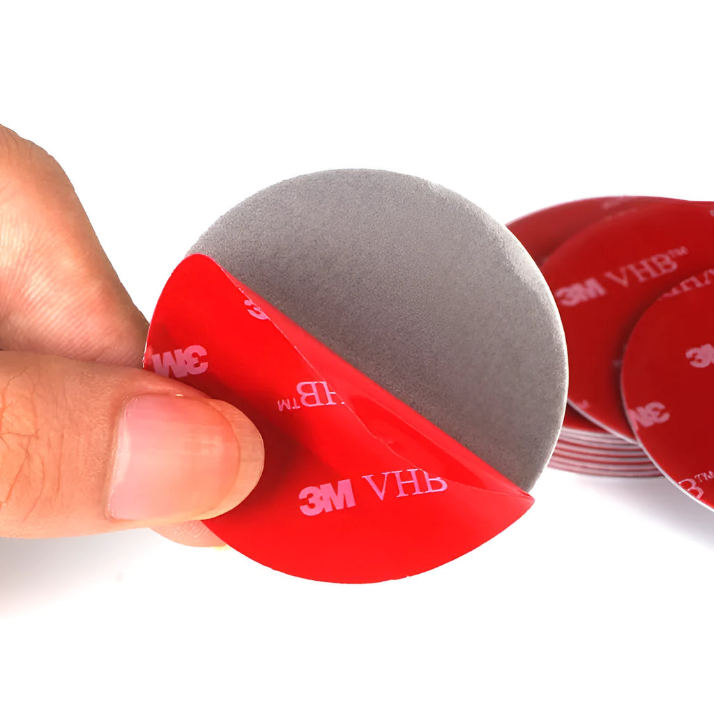 Round red PU foam double sided adhesive tape pads in various sizes on a white background