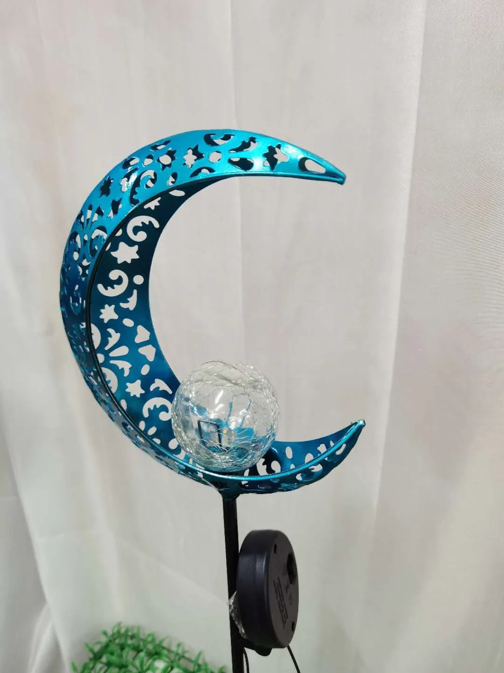 Solar hollow wrought iron blue moon LED lawn light with crack glass ball on grass