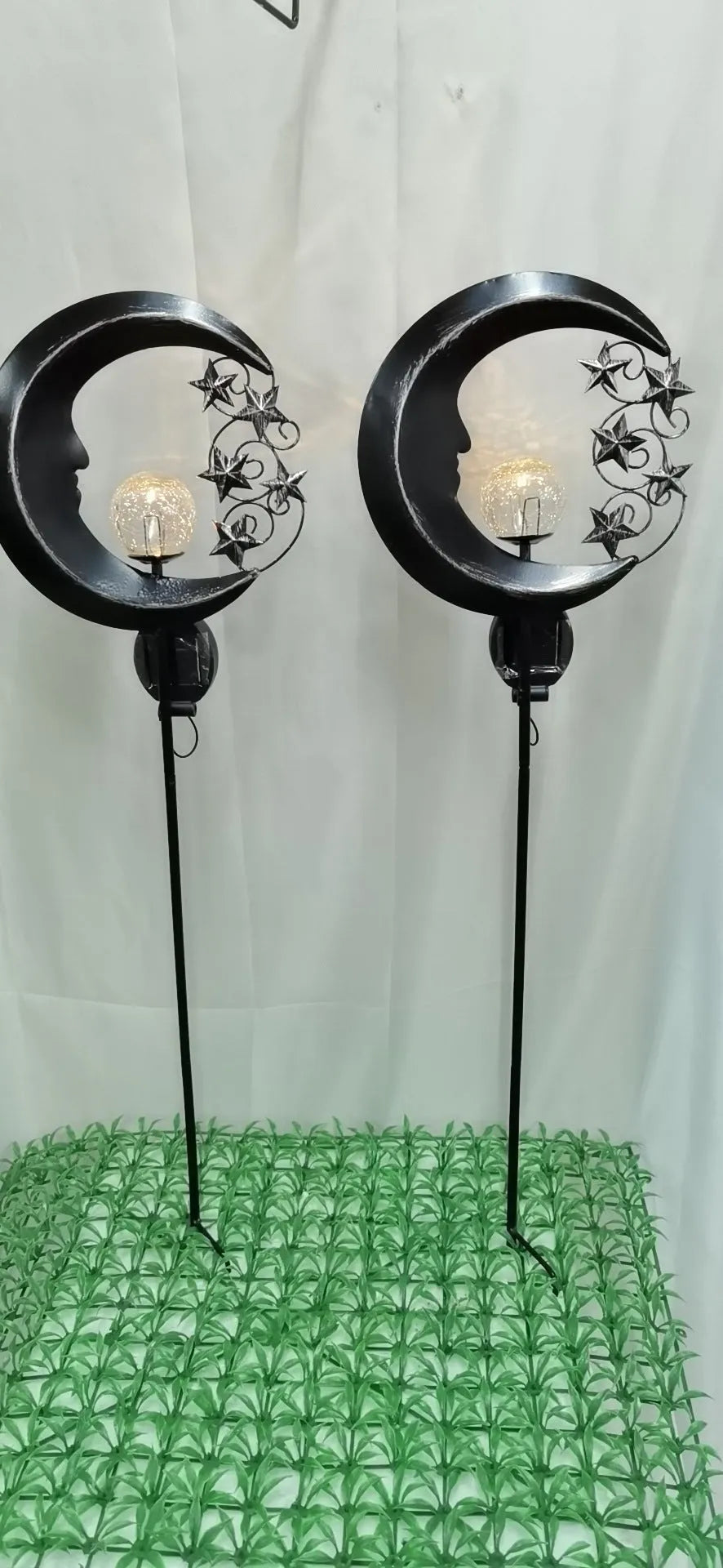 Solar hollow wrought iron blue moon LED lawn light with crack glass ball on grass